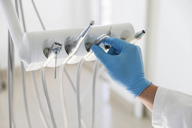 Professional Root Canal Treatment technician working in Village St. George, LA